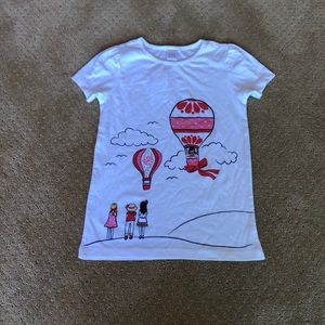 White tee with girl graphic.